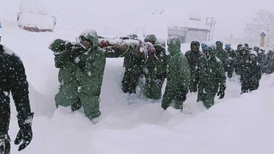 In this handout photo supplied by the Indian Army, a team carries out rescue operations for trapped construction workers who were swept away by an avalanche near the Mana Pass in Chamoli district of Uttarakhand. (AP) In this handout photo supplied by the Indian Army, a team carries out rescue operations for trapped construction workers who were swept away by an avalanche near the Mana Pass in Chamoli district of Uttarakhand. (AP)