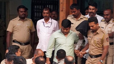 The accused arrested for raping a woman inside a parked state transport bus at Swargate terminus, being produced at a court, in Pune, Friday, Feb. 28, 2025. (PTI)
