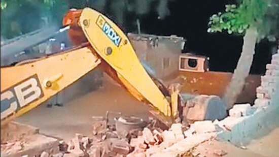 Ludhiana police claimed that the house was built illegally on panchayat land, and arrested the woman, Kulbir Kaur, and her husband, Balwant Singh. The FIR against them was registered earlier in the day. (HT Photo)