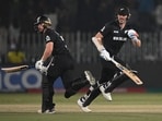New Zealand's Glenn Phillips (L) and Michael Bracewell (R) run between the wickets