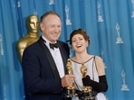 This photograph taken on March 29, 1993, shows US actor Gene Hackman (L) and US actress Marisa Tomei posing with their oscars shortly after being respectively awarded best supporting actor and best supporting actress in Los Angeles. Oscar-winning US actor Gene Hackman and his wife Betsy Arakawa have been found dead inside their home in New Mexico, media outlets reported on February 27, 2025. Santa Fe County Sheriff Adan Mendoza said the couple were found dead the day before afternoon, adding that there was no immediate indication of foul play, according to the Santa Fe New Mexican, Variety and Sky News. (Photo by Scott FLYNN / AFP)