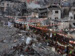 Palestinians break their fast by eating the Iftar meals during the holy month of Ramadan, near the rubble of buildings, amid a ceasefire between Israel and Hamas, in Rafah, in the southern Gaza Strip, March 1, 2025. 