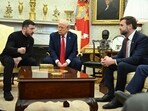 Ukraine's President Volodymyr Zelensky speaks to US Vice President JD Vance as they meet with President Donald Trump in the Oval Office of the White House in Washington, DC, February 28, 2025. 