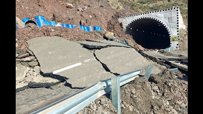 A portion of a road damaged outside Peerah tunnel following landslides in Ramban on Saturday. (PTI) A portion of a road damaged outside Peerah tunnel following landslides in Ramban on Saturday. (PTI)