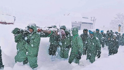 An Indian Army team carries out rescue operations to bring out the trapped construction workers near Mana Pass in Chamoli district of Uttarakhand on Friday. (AP) An Indian Army team carries out rescue operations to bring out the trapped construction workers near Mana Pass in Chamoli district of Uttarakhand on Friday. (AP)