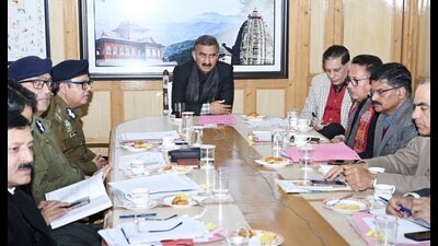 Chief minister Sukhvinder Singh Sukhu chairs a meeting of police and other officials in Shimla on Saturday. (HT photo )