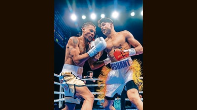 Dev (above right) floors his opponent, California boxer Alton Wiggins, at his first pro bout in Las Vegas, in January. Dev (above right) floors his opponent, California boxer Alton Wiggins, at his first pro bout in Las Vegas, in January.