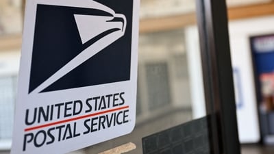 USPS to implement changes to First-Class Mail services aiming to save $36 billion over a decade.
(Photo by Patrick T. Fallon / AFP) (AFP) USPS to implement changes to First-Class Mail services aiming to save $36 billion over a decade.
(Photo by Patrick T. Fallon / AFP) (AFP)