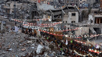 Palestinians break their fast by eating the Iftar meals during the holy month of Ramadan, near the rubble of buildings, amid a ceasefire between Israel and Hamas, in Rafah, in the southern Gaza Strip, March 1, 2025. (REUTERS)