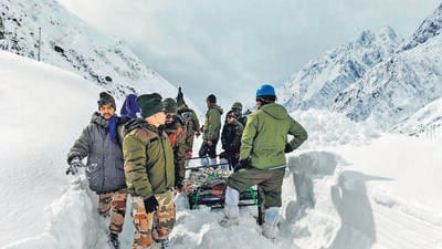 ITBP personnel carry out rescue operations to bring out the trapped workers in Chamoli on Saturday. (ANI)