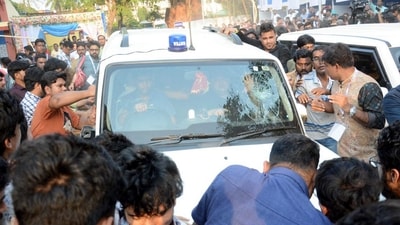 Students' Federation of India (SFI) members gather around West Bengal Education Minister Bratya Basu's car at Jadavpur University campus, in Kolkata, Saturday, March 1, 2025. (PTI) Students' Federation of India (SFI) members gather around West Bengal Education Minister Bratya Basu's car at Jadavpur University campus, in Kolkata, Saturday, March 1, 2025. (PTI)