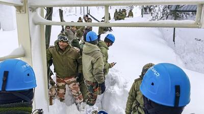 Security personnel conduct a rescue operation after several labourers were trapped under snow and debris in Mana area of Chamoli district on Saturday. (PTI) Security personnel conduct a rescue operation after several labourers were trapped under snow and debris in Mana area of Chamoli district on Saturday. (PTI)