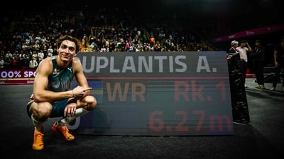 Swedish athlete Armand Duplantis poses next to a screen displaying his record as he celebrates after beating his own world record at 6.27m. (AFP) Swedish athlete Armand Duplantis poses next to a screen displaying his record as he celebrates after beating his own world record at 6.27m. (AFP)
