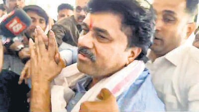 Walmik Karad, a close aide of Maharashtra minister Dhananjay Munde, as he surrenders before the Crime Investigation Department (CID) in Pune on Dec. 31, 2024. (PTI) Walmik Karad, a close aide of Maharashtra minister Dhananjay Munde, as he surrenders before the Crime Investigation Department (CID) in Pune on Dec. 31, 2024. (PTI)