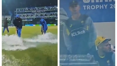 Groundstaff trying to mop out water from the covers in Lahore as Australia players look on Groundstaff trying to mop out water from the covers in Lahore as Australia players look on