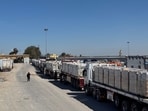 Trucks carrying humanitarian aid line up on the Egyptian side of the Rafah border crossing with the Gaza Strip on March 2, 2025, after Israel suspended the entry of supplies into the Palestinian enclave. Trucks carrying humanitarian aid line up on the Egyptian side of the Rafah border crossing with the Gaza Strip on March 2, 2025, after Israel suspended the entry of supplies into the Palestinian enclave.