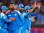 Dubai: India's Varun Chakaravarthy with teammate Virat Kohli and others celebrates the wicket of New Zealand's Matt Henry during the ICC Champions Trophy Dubai: India's Varun Chakaravarthy with teammate Virat Kohli and others celebrates the wicket of New Zealand's Matt Henry during the ICC Champions Trophy