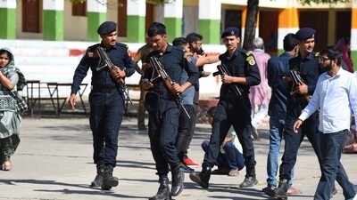 Haryana police commando deployed during the Gurugram Civic Body Elections at Government Senior Secondary School in Nathupur village near DLF phase-3, in Gurugram, India, on Sunday, 02 March 2025. (Parveen Kumar/Hindustan Times)
