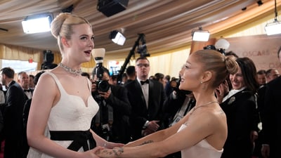 Elle Fanning, left, and Ariana Grande arrive at the Oscars on Sunday. (John Locher/Invision/AP) Elle Fanning, left, and Ariana Grande arrive at the Oscars on Sunday. (John Locher/Invision/AP)