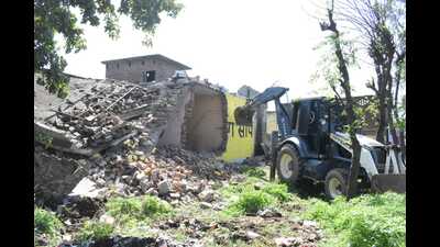 A house of a drug smuggler being demolished in Phillaur on Sunday. (HT) A house of a drug smuggler being demolished in Phillaur on Sunday. (HT)