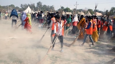 Sanitation workers took to cleaning up the grounds on the banks of the Triveni Sangam where devotees had resided for more than a month (HT Photo) Sanitation workers took to cleaning up the grounds on the banks of the Triveni Sangam where devotees had resided for more than a month (HT Photo)