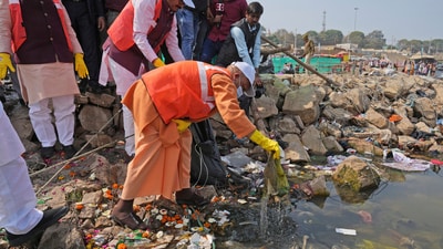 After observing 54 days of the Maha Kumbh festival in Prayagraj, whcih garnered more than 66 crore visitors to the city, Uttar Pradesh chief minister Yogi Adityanath joined in cleaning the grounds and the river. (Rajesh Kumar Singh/AP) After observing 54 days of the Maha Kumbh festival in Prayagraj, whcih garnered more than 66 crore visitors to the city, Uttar Pradesh chief minister Yogi Adityanath joined in cleaning the grounds and the river. (Rajesh Kumar Singh/AP)
