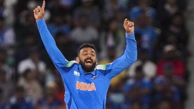 India spinner Varun Chakravarthy celebrates the wicket of New Zealand's Glenn Phillips in the Champions Trophy Group A win in Dubai on Sunday (PTI) India spinner Varun Chakravarthy celebrates the wicket of New Zealand's Glenn Phillips in the Champions Trophy Group A win in Dubai on Sunday (PTI)