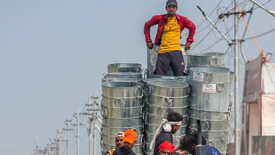 After the Mela got over, workers brought in large garbage cans to deal with the waste created by humans during the festivities (PTI) After the Mela got over, workers brought in large garbage cans to deal with the waste created by humans during the festivities (PTI)