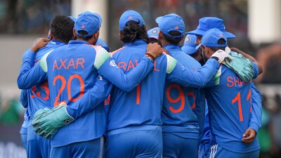 Dubai: India players before start of the second innings during the ICC Champions Trophy cricket match between India and New Zealand, in Dubai (PTI) Dubai: India players before start of the second innings during the ICC Champions Trophy cricket match between India and New Zealand, in Dubai (PTI)