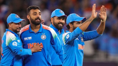 Dubai: India's Varun Chakaravarthy with teammate Virat Kohli and others celebrates the wicket of New Zealand's Matt Henry during the ICC Champions Trophy (PTI) Dubai: India's Varun Chakaravarthy with teammate Virat Kohli and others celebrates the wicket of New Zealand's Matt Henry during the ICC Champions Trophy (PTI)