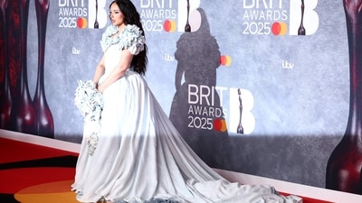 British singer JADE wore a stunning white gown with long voluminous train and flowers encrusted around the shoulder pads. It channeled a fairytale-esque energy. (AFP) British singer JADE wore a stunning white gown with long voluminous train and flowers encrusted around the shoulder pads. It channeled a fairytale-esque energy. (AFP)
