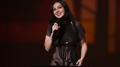 Charlie was seen in a Dilara Findikoglu dress that was a risqué see-through gown with sheer fabric. (AP) Charlie was seen in a Dilara Findikoglu dress that was a risqué see-through gown with sheer fabric. (AP)