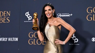 TOPSHOT - US actress Demi Moore poses with the Best Performance by a Female Actor in a Motion Picture � Musical or Comedy award for "The Substance" in the press room during the 82nd annual Golden Globe Awards at the Beverly Hilton hotel in Beverly Hills, California, on January 5, 2025. (Photo by Robyn Beck / AFP) (AFP) TOPSHOT - US actress Demi Moore poses with the Best Performance by a Female Actor in a Motion Picture � Musical or Comedy award for "The Substance" in the press room during the 82nd annual Golden Globe Awards at the Beverly Hilton hotel in Beverly Hills, California, on January 5, 2025. (Photo by Robyn Beck / AFP) (AFP)