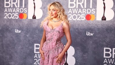 Sabrina Carpenter turned heads in a gorgeous custom Alexander McQueen gown. The baby pink gown had ruched detailing with a neat, scoop neckline. The diamond choker with pink gem in the center complemented her look. (AFP) Sabrina Carpenter turned heads in a gorgeous custom Alexander McQueen gown. The baby pink gown had ruched detailing with a neat, scoop neckline. The diamond choker with pink gem in the center complemented her look. (AFP)