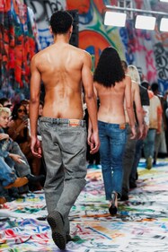 Low rise jeans with revealing butt cracks at the Diesel show