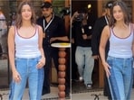 Alia Bhatt showcased a stylish outfit at a Mumbai event, featuring a white tank top and dual-tone baggy jeans. Alia Bhatt showcased a stylish outfit at a Mumbai event, featuring a white tank top and dual-tone baggy jeans.