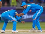 Virat Kohli tries to touch the feet of Axar Patel who dismissed Kane Williamson during the ICC Champions Trophy match between India and New Zealand Virat Kohli tries to touch the feet of Axar Patel who dismissed Kane Williamson during the ICC Champions Trophy match between India and New Zealand