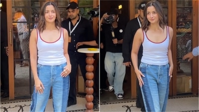 Alia Bhatt showcased a stylish outfit at a Mumbai event, featuring a white tank top and dual-tone baggy jeans. (Ashutosh Rai) Alia Bhatt showcased a stylish outfit at a Mumbai event, featuring a white tank top and dual-tone baggy jeans. (Ashutosh Rai)