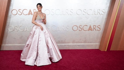 Monica Barbaro, nominated for Best Supporting Actress, arrives at the Oscars. The actor wears a custom Dior baby pink gown by Maria Grazia Chiuri. (Jae C. Hong/Invision/AP) Monica Barbaro, nominated for Best Supporting Actress, arrives at the Oscars. The actor wears a custom Dior baby pink gown by Maria Grazia Chiuri. (Jae C. Hong/Invision/AP)
