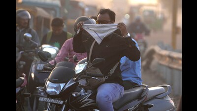 A man covers his face to protect himself from pollution in Ahmedabad on February 5. (AP) A man covers his face to protect himself from pollution in Ahmedabad on February 5. (AP)