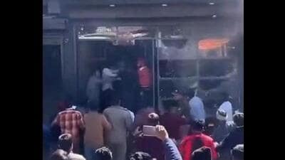 A video grab of the mob assaulting the Sikh businessman and vandalising his showroom in Uttarakhand’s Rishikesh on Sunday. A video grab of the mob assaulting the Sikh businessman and vandalising his showroom in Uttarakhand’s Rishikesh on Sunday.