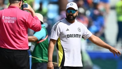 India's captain Rohit Sharma gestures while inspecting the pitch before the start of the ICC Champions Trophy one-day international (ODI) cricket match between Pakistan and India at the Dubai International Stadium in Dubai on February 23, 2025. (Photo by Jewel SAMAD / AFP) (AFP) India's captain Rohit Sharma gestures while inspecting the pitch before the start of the ICC Champions Trophy one-day international (ODI) cricket match between Pakistan and India at the Dubai International Stadium in Dubai on February 23, 2025. (Photo by Jewel SAMAD / AFP) (AFP)