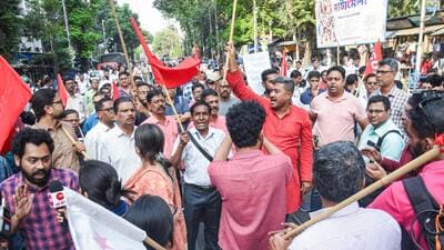 Members of CPI(M) students wing SFI stage a protest against West Bengal education minister, Bratya Basu, at Calcutta University in Kolkata on Monday. (ANI Photo) Members of CPI(M) students wing SFI stage a protest against West Bengal education minister, Bratya Basu, at Calcutta University in Kolkata on Monday. (ANI Photo)
