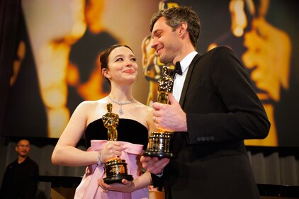 Mikey Madison holds the Oscar for the Best Actress for "Anora" and  producer Alex Coco  pose with the Oscar for Best Picture for "Anora". (REUTERS)