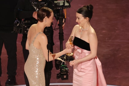 Emma Stone presents Mikey Madison with the Oscar for Best Actress in a Leading Role for "Anora" during the Oscars show at the 97th Academy Awards in Hollywood, Los Angeles, California, U.S., March 2, 2025. REUTERS/Carlos Barria (REUTERS)