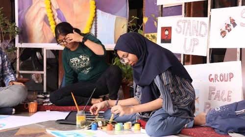 Youths participating at the painting competition Youths participating at the painting competition