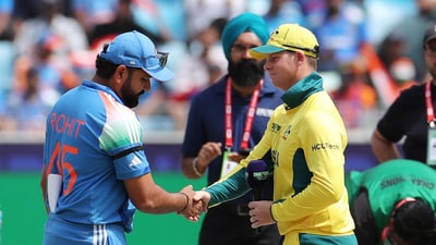 India captain Rohit Sharma, wearing a black armband, shakes hands with Australia's Steve Smith (REUTERS)