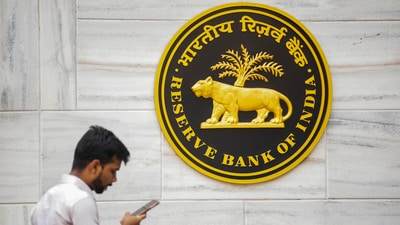 A man walks past the RBI logo at RBI headquarters in Mumbai, Friday, Feb. 7, 2025. (Shashank Parade/PTI) A man walks past the RBI logo at RBI headquarters in Mumbai, Friday, Feb. 7, 2025. (Shashank Parade/PTI)