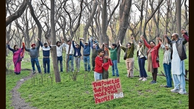 Residents held a ‘hug a tree’ demonstration to protest the felling of 50 trees near the Rock Garden in Chandigarh on Tuesday. (Keshav Singh/HT) Residents held a ‘hug a tree’ demonstration to protest the felling of 50 trees near the Rock Garden in Chandigarh on Tuesday. (Keshav Singh/HT)