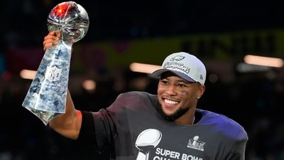 Philadelphia Eagles running back Saquon Barkley celebrates with the Vince Lombardi Trophy after the NFL Super Bowl 59 football game against the Kansas City Chiefs, Sunday, Feb. 9, 2025, in New Orleans. (AP) Philadelphia Eagles running back Saquon Barkley celebrates with the Vince Lombardi Trophy after the NFL Super Bowl 59 football game against the Kansas City Chiefs, Sunday, Feb. 9, 2025, in New Orleans. (AP)